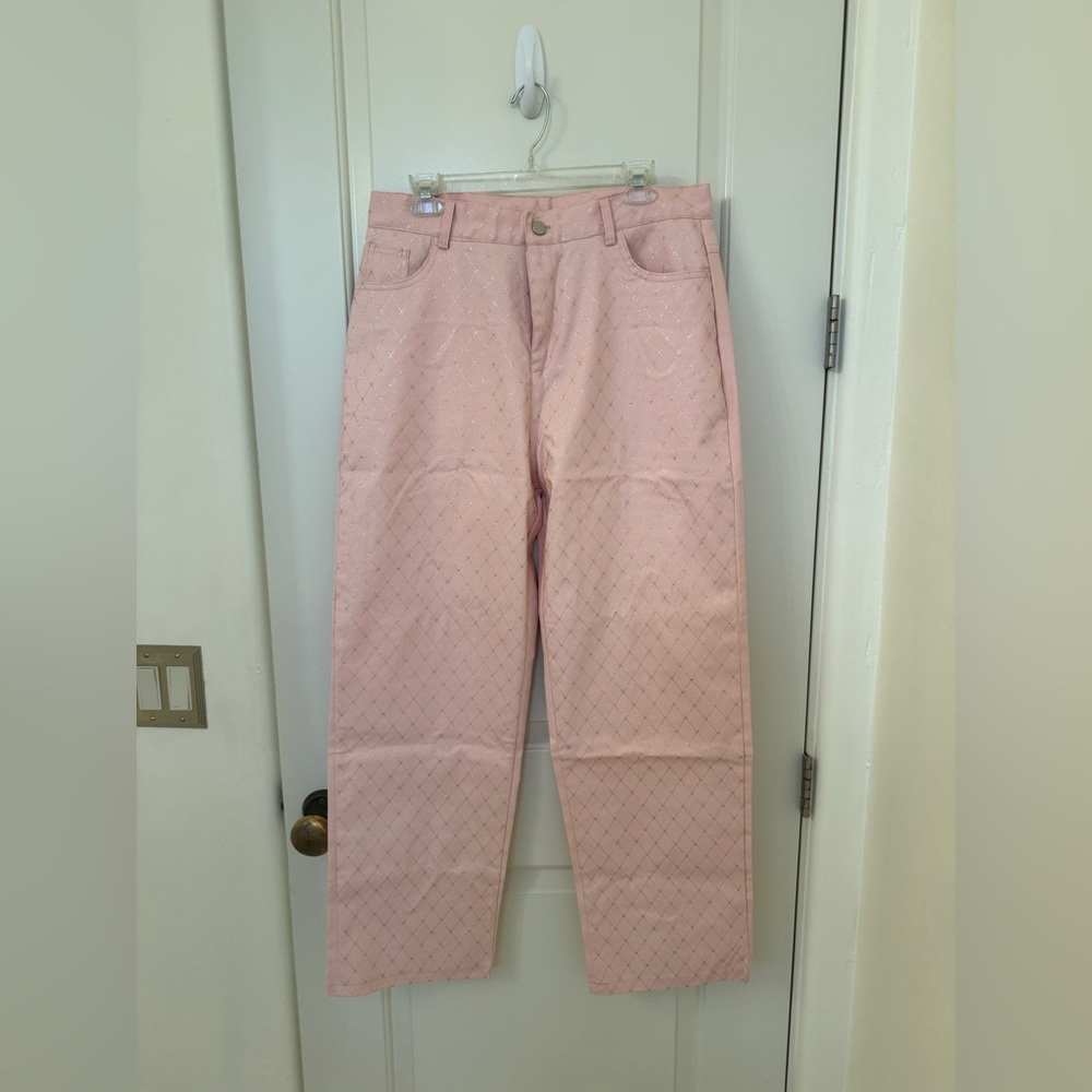 Size XL pretty pink jeans with silver foil embellishments. Do not know the brand